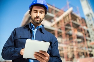 Construction-specialist-using-tablet